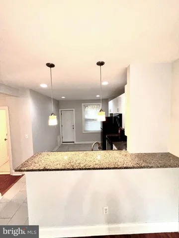 a view of living room and kitchen