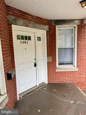 a front view of a house with a street