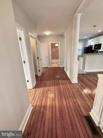 a view of a room with wooden floor and stairs