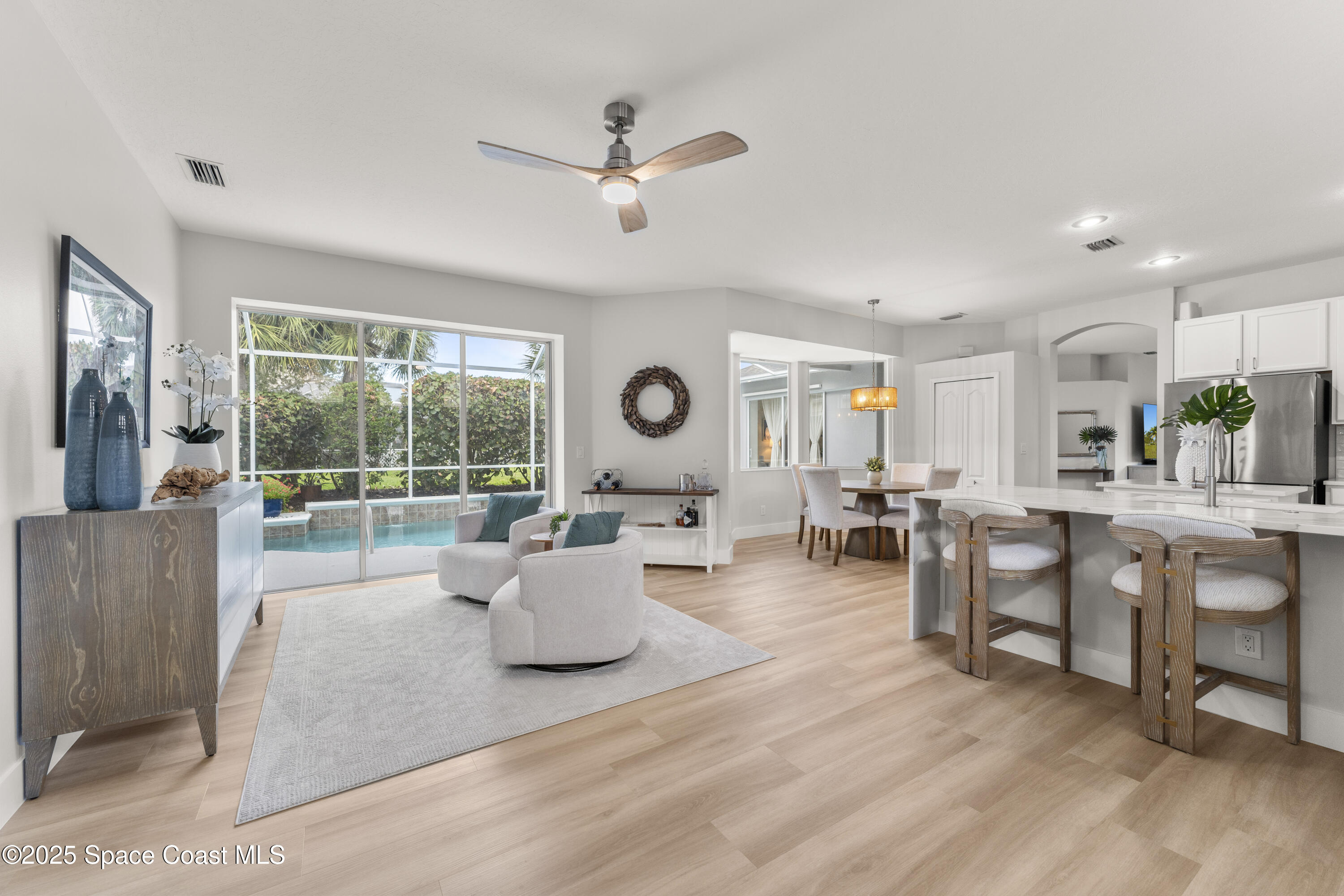 3053 Jacobaeus Lane Indialantic, FL 32903 - Photo 13 of 35 a living room with furniture and a large window