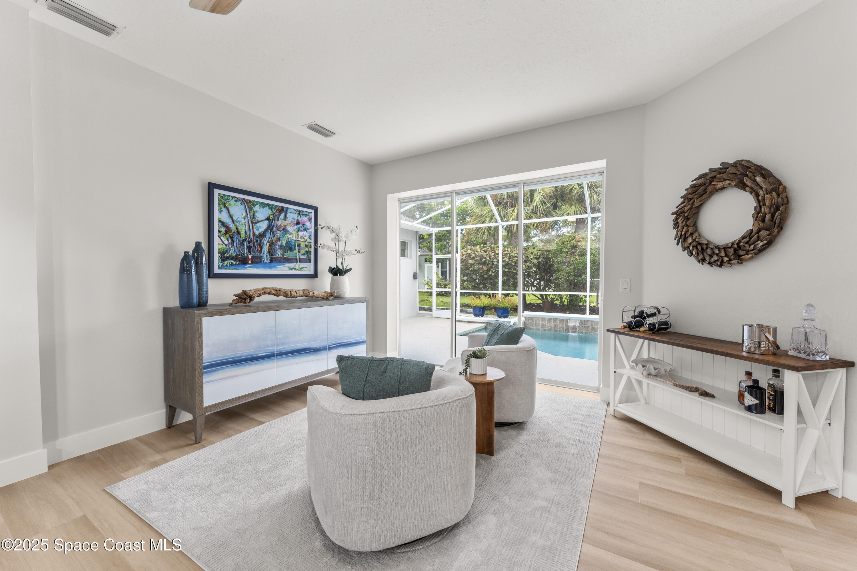 3053 Jacobaeus Lane Indialantic, FL 32903 - Photo 14 of 35 a living room with furniture and a large window