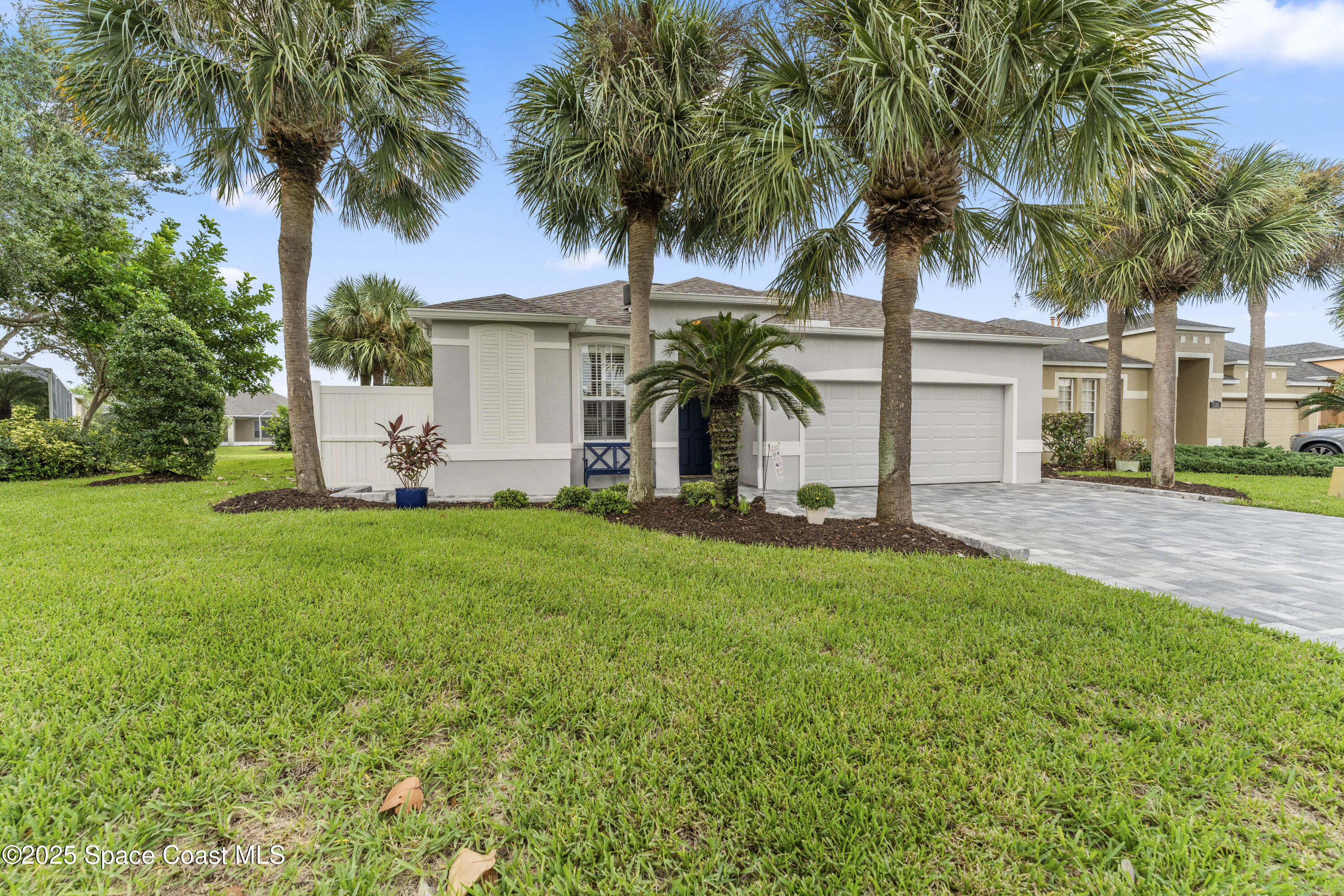 3053 Jacobaeus Lane Indialantic, FL 32903 - Photo 2 of 35 a front view of house with yard and green space