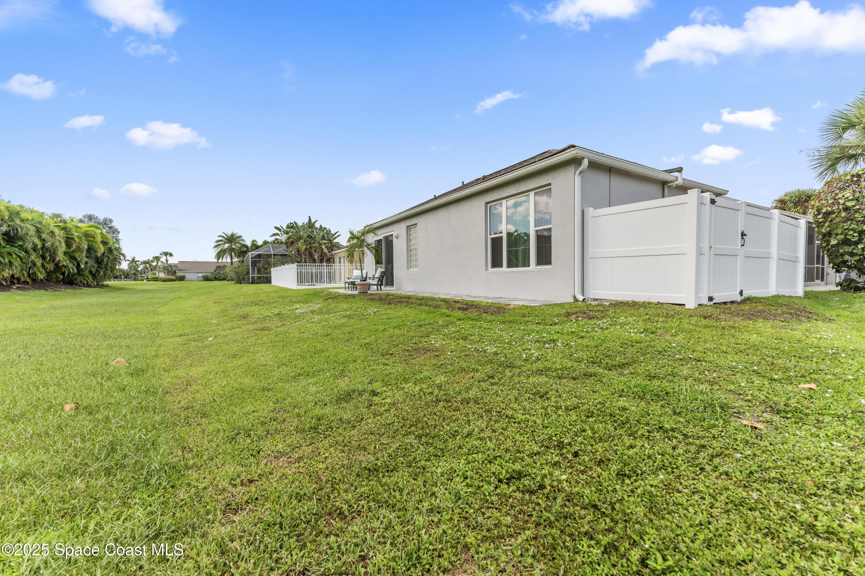 3053 Jacobaeus Lane Indialantic, FL 32903 - Photo 29 of 35 a view of a backyard with a garden