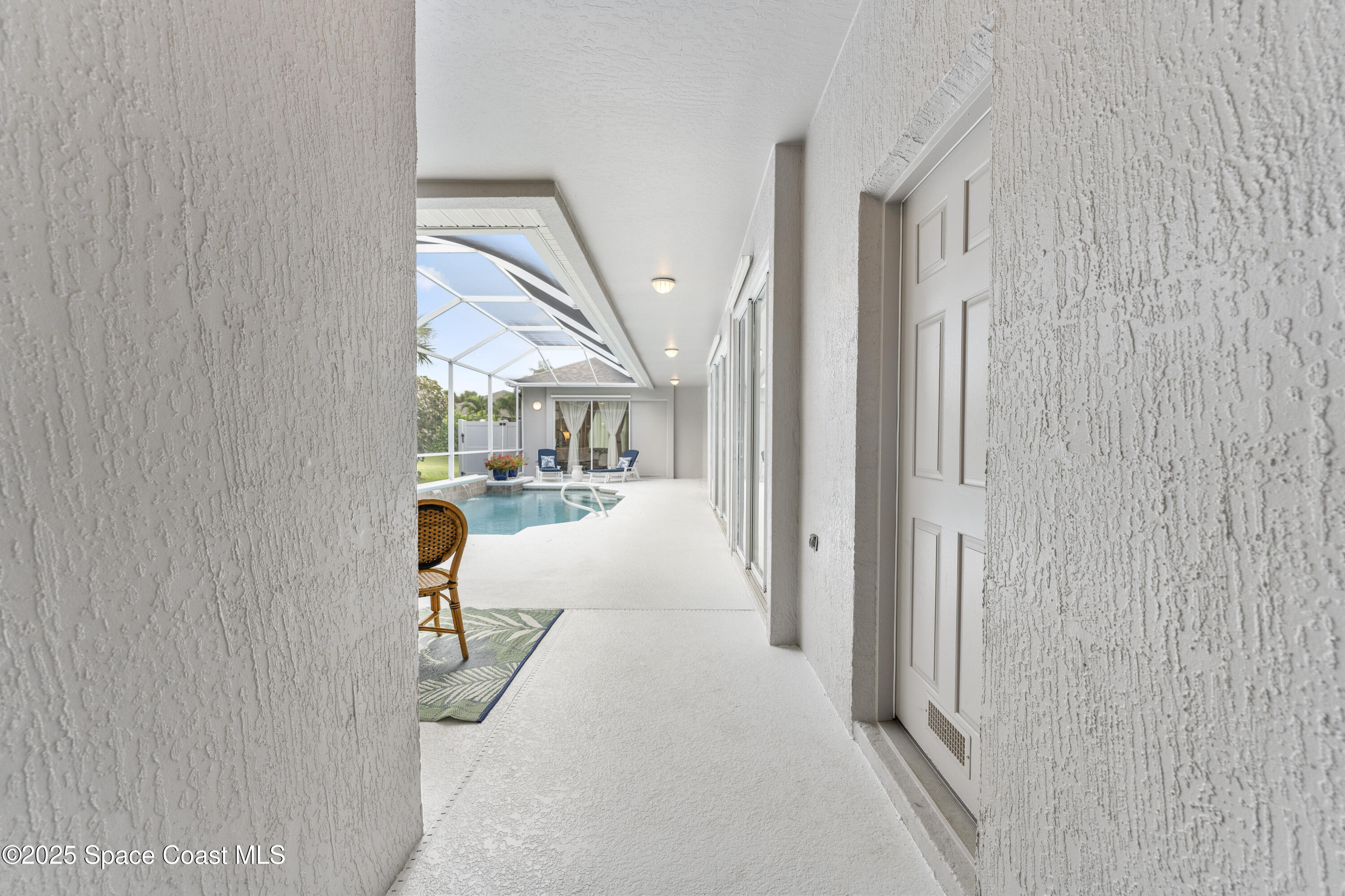 3053 Jacobaeus Lane Indialantic, FL 32903 - Photo 4 of 35 a view of a living room hardwood floor and a hallway