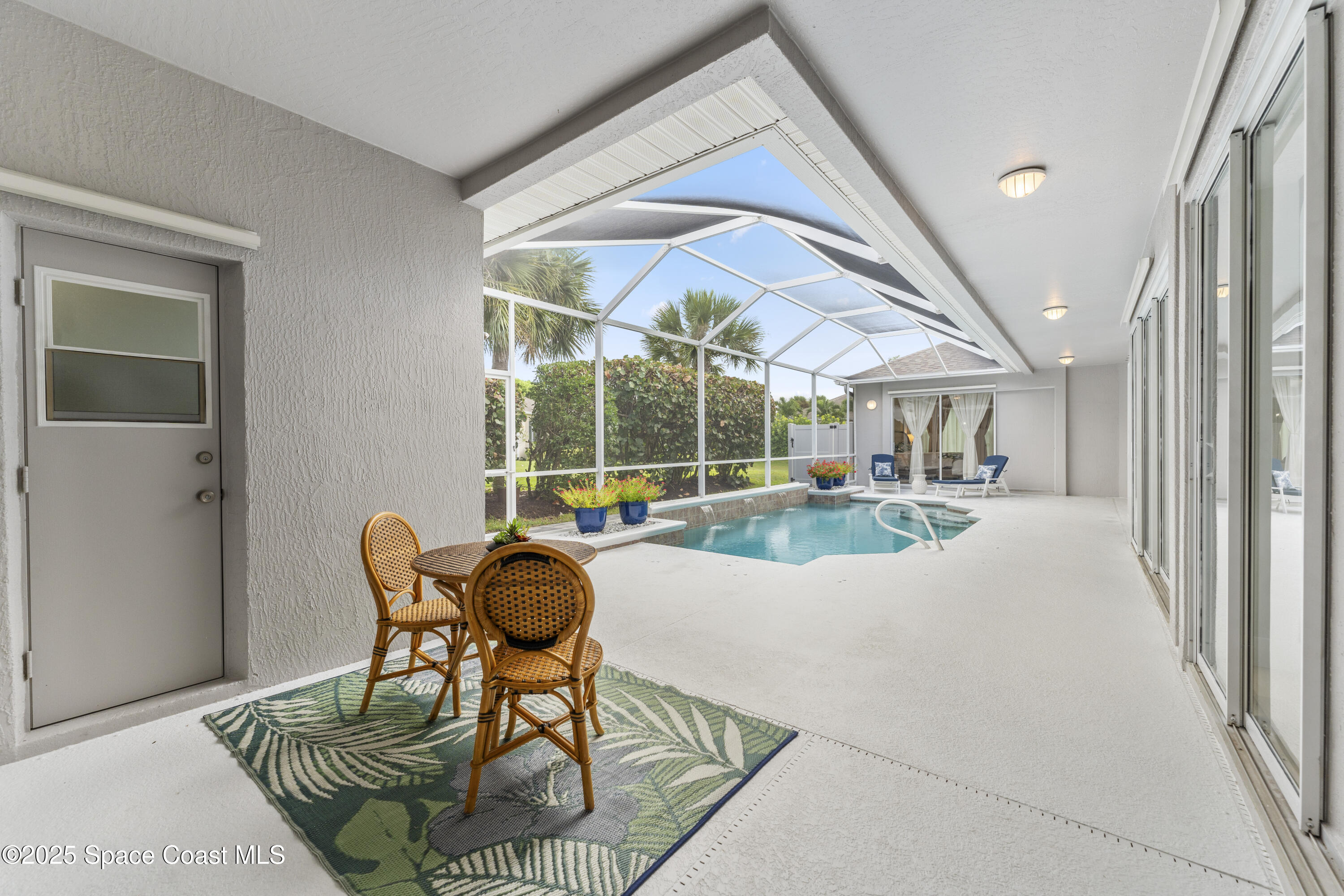 3053 Jacobaeus Lane Indialantic, FL 32903 - Photo 5 of 35 a living room with furniture and a floor to ceiling window