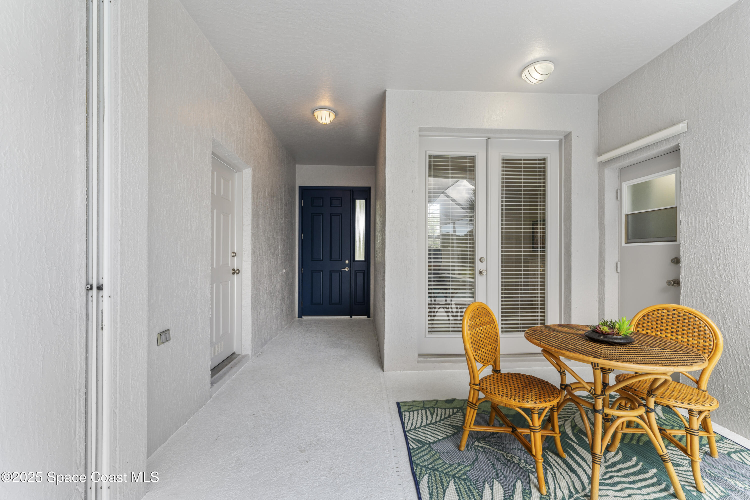 3053 Jacobaeus Lane Indialantic, FL 32903 - Photo 6 of 35 a view of a dining room with furniture and wooden floor