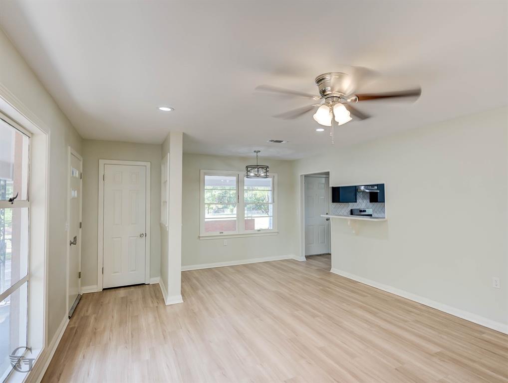 809 Horton Street Minden, LA 71055 - Photo 11 of 20 a view of empty room with wooden floor and fan