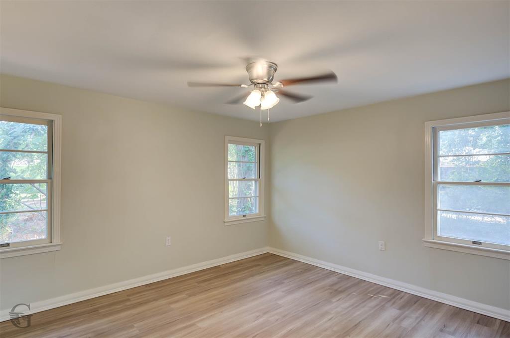 809 Horton Street Minden, LA 71055 - Photo 14 of 20 a view of an empty room with a window and wooden floor