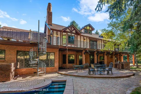 a view of a building with a fountain in a patio