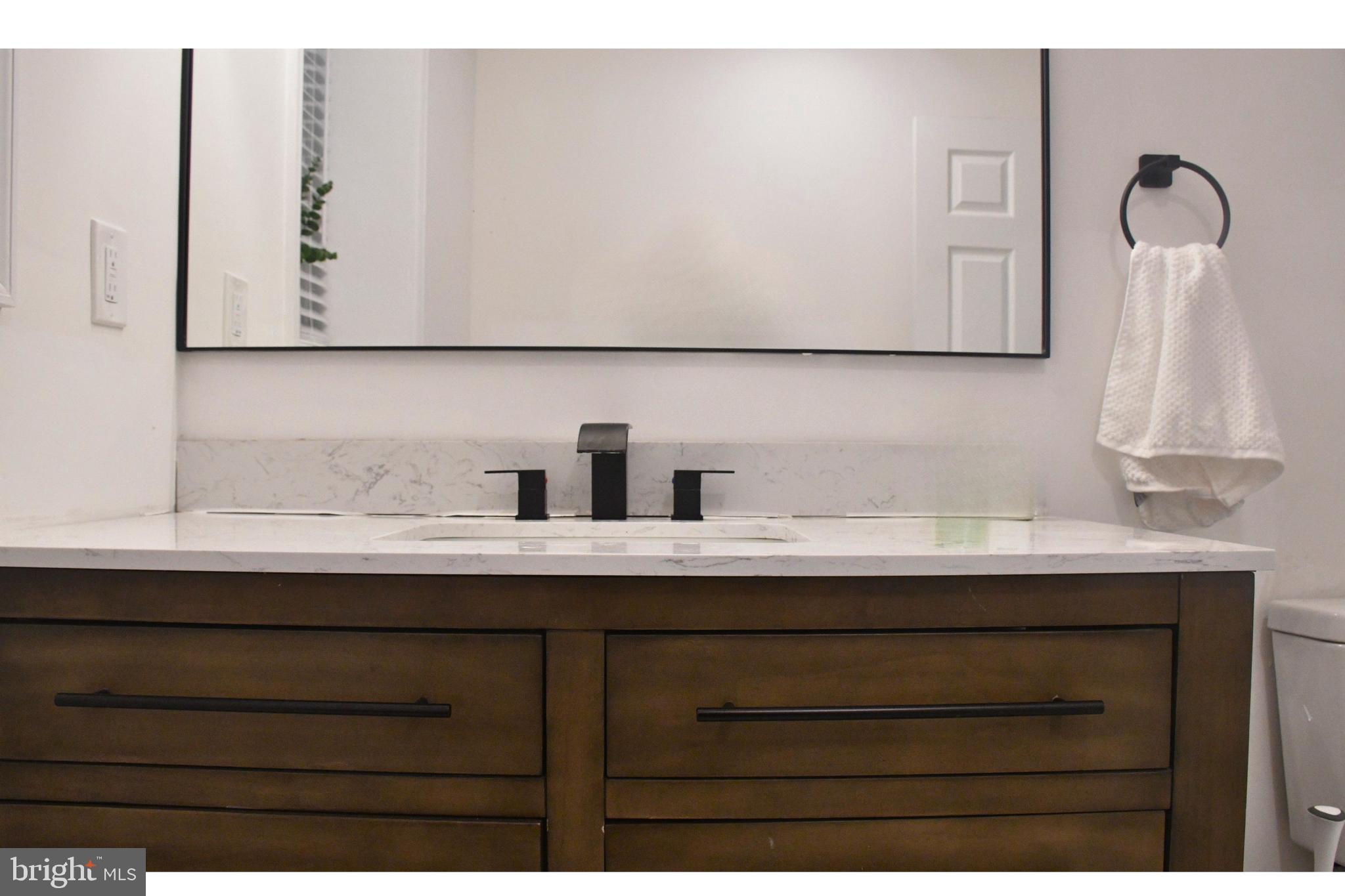 17930 Masemore Road Parkton, MD 21120 - Photo 22 of 46 a bathroom with a sink and a mirror