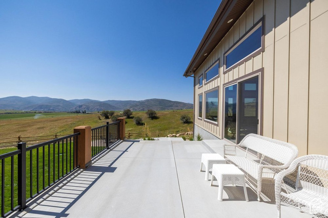 6117 North Rocky Ridge Road Peoa, UT 84061 - Photo 19 of 83 View of patio featuring a mountain view and a rural view