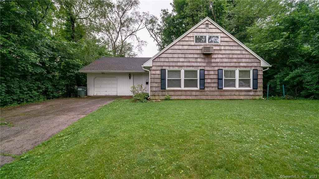 567 Palmetto Road Bridgeport, CT 06606 - Photo 1 of 1 a view of a house with a yard and large trees