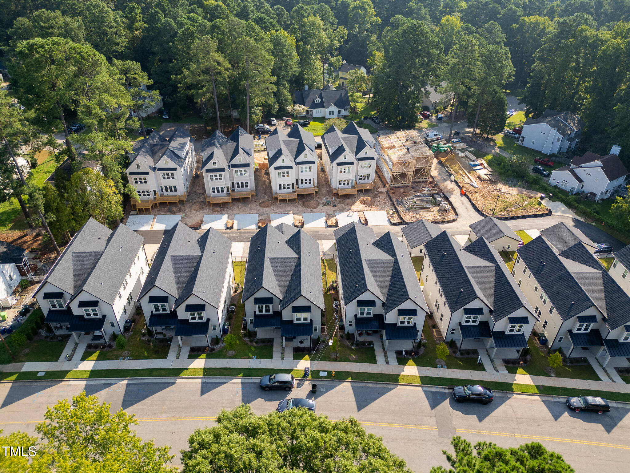857 Athens Drive, Unit 101 Raleigh, NC 27606 - Photo 50 of 57 an aerial view of residential houses with outdoor space