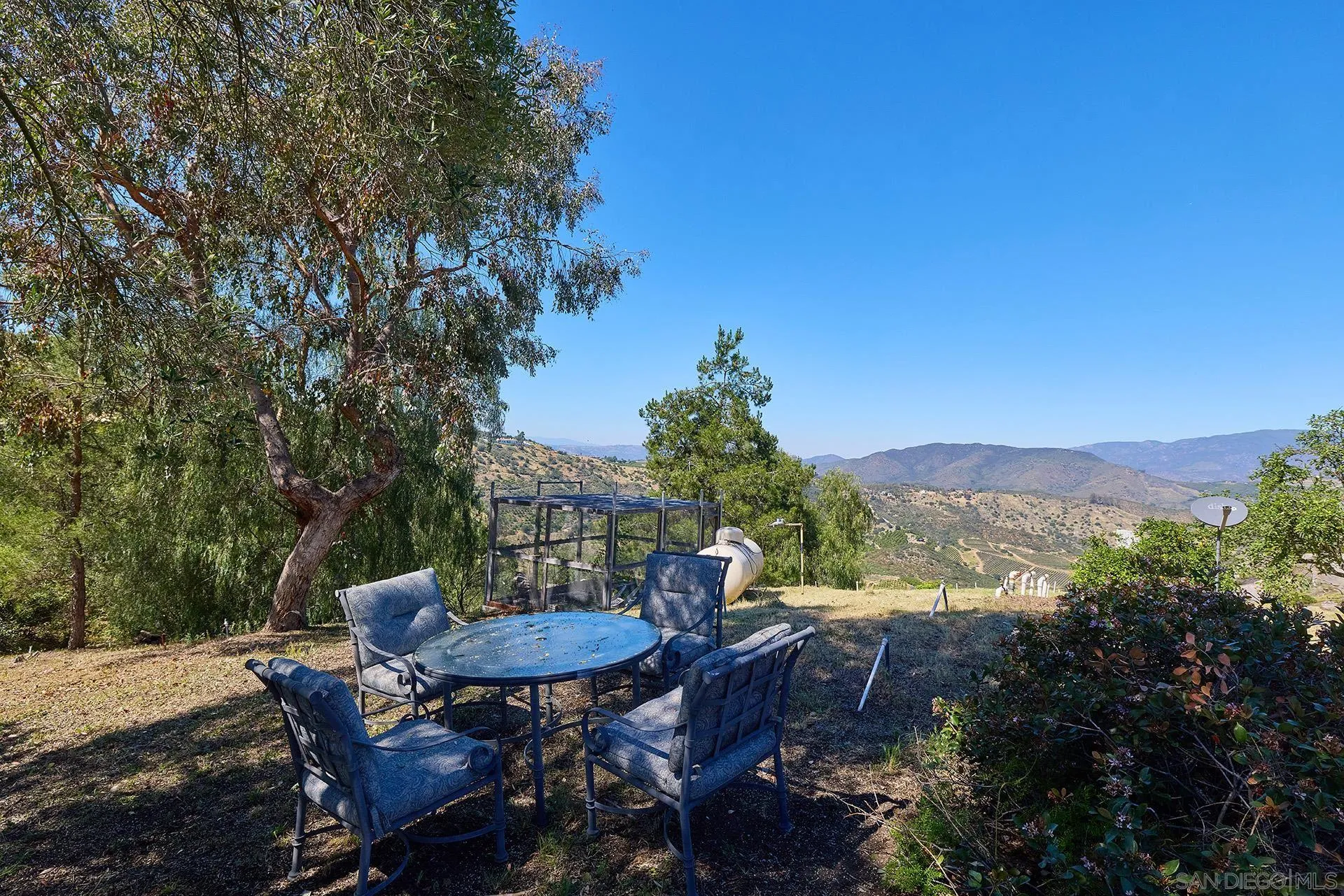 13588 McNally Road Valley Center, CA 92082 - Photo 43 of 43 a view of a balcony with a table and chairs