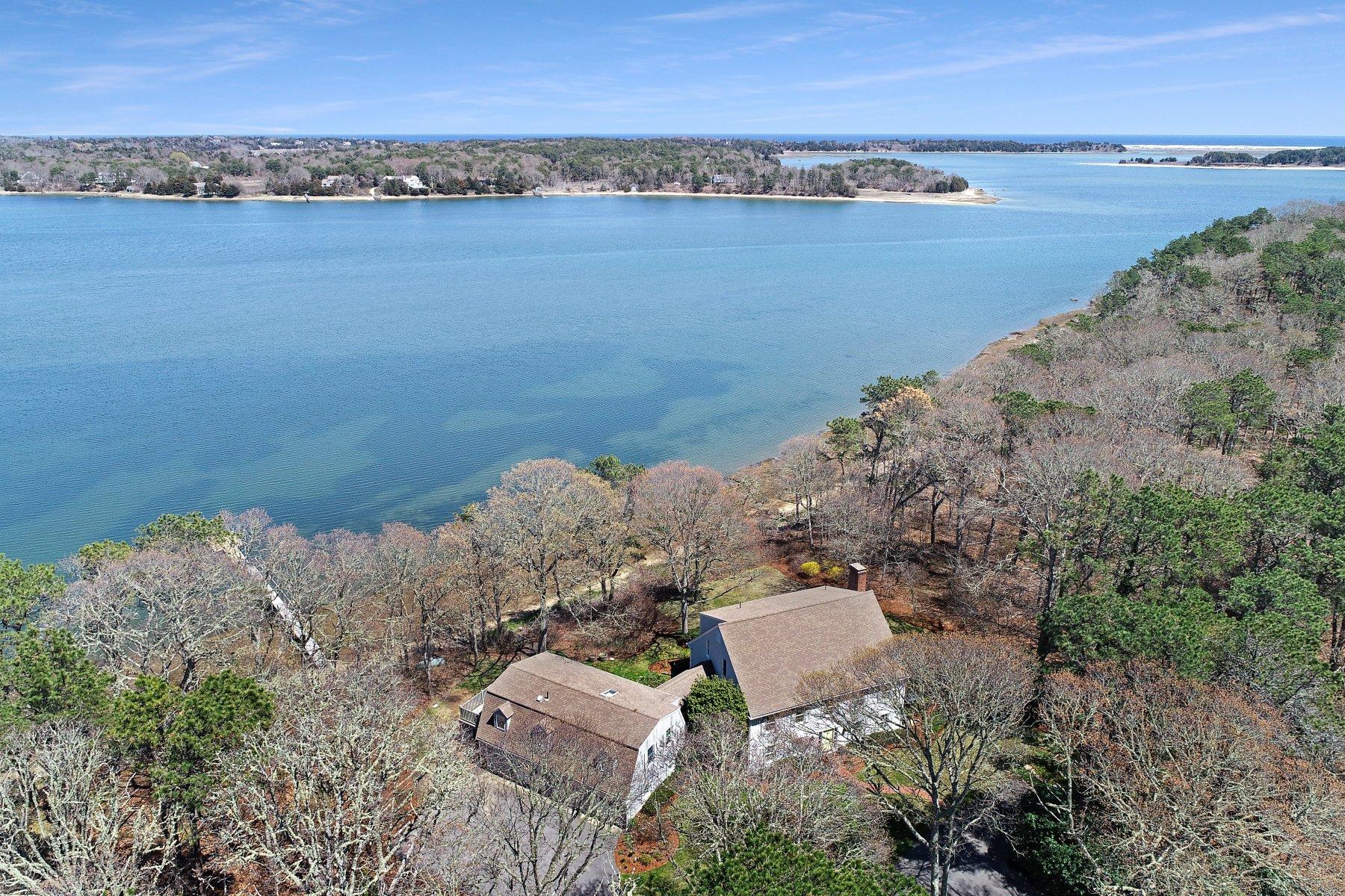 7 Portside Lane Orleans, MA 02653 - Photo 14 of 34 a view of a lake with a mountain in the background
