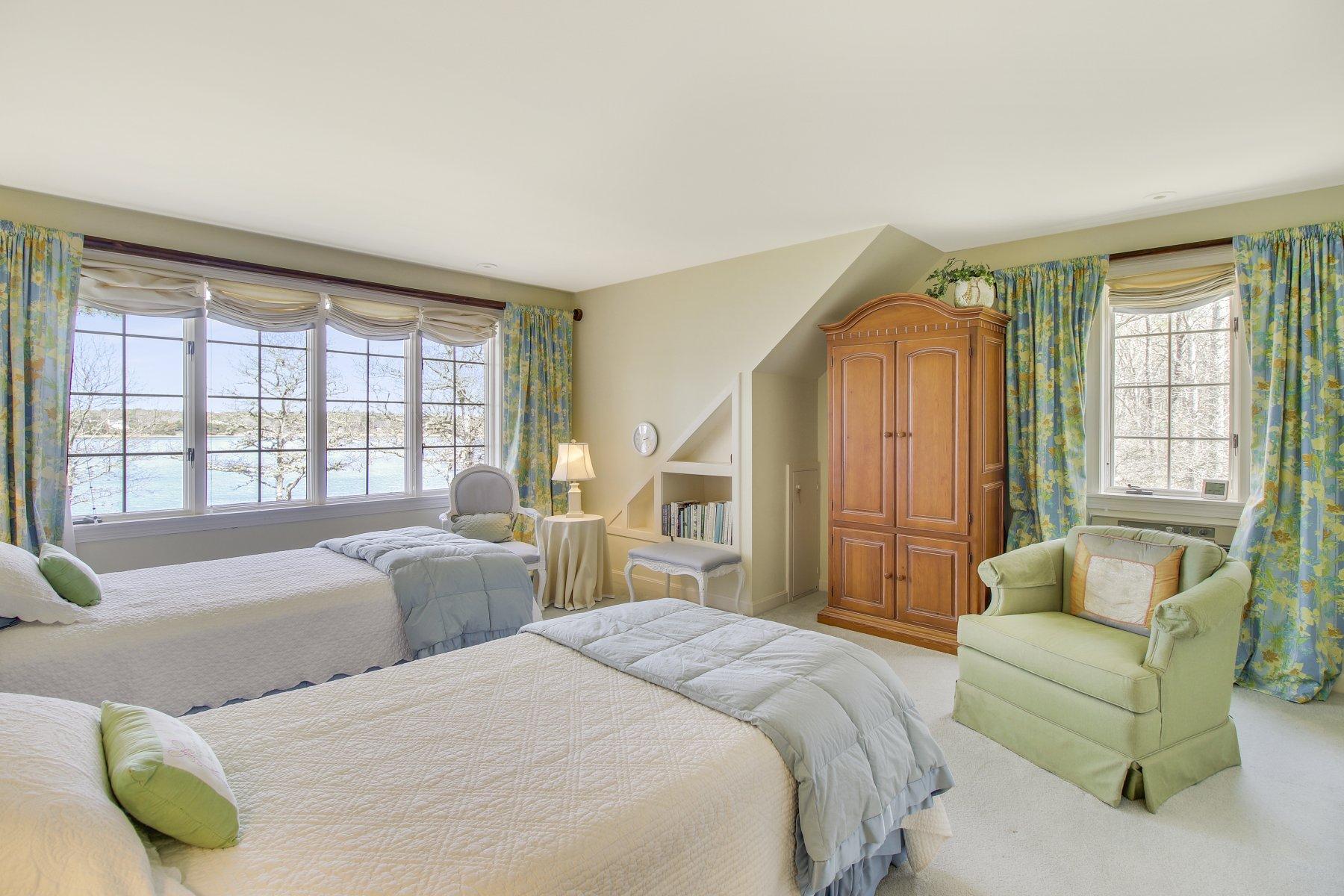 7 Portside Lane Orleans, MA 02653 - Photo 21 of 34 a bedroom with a bed couch and window