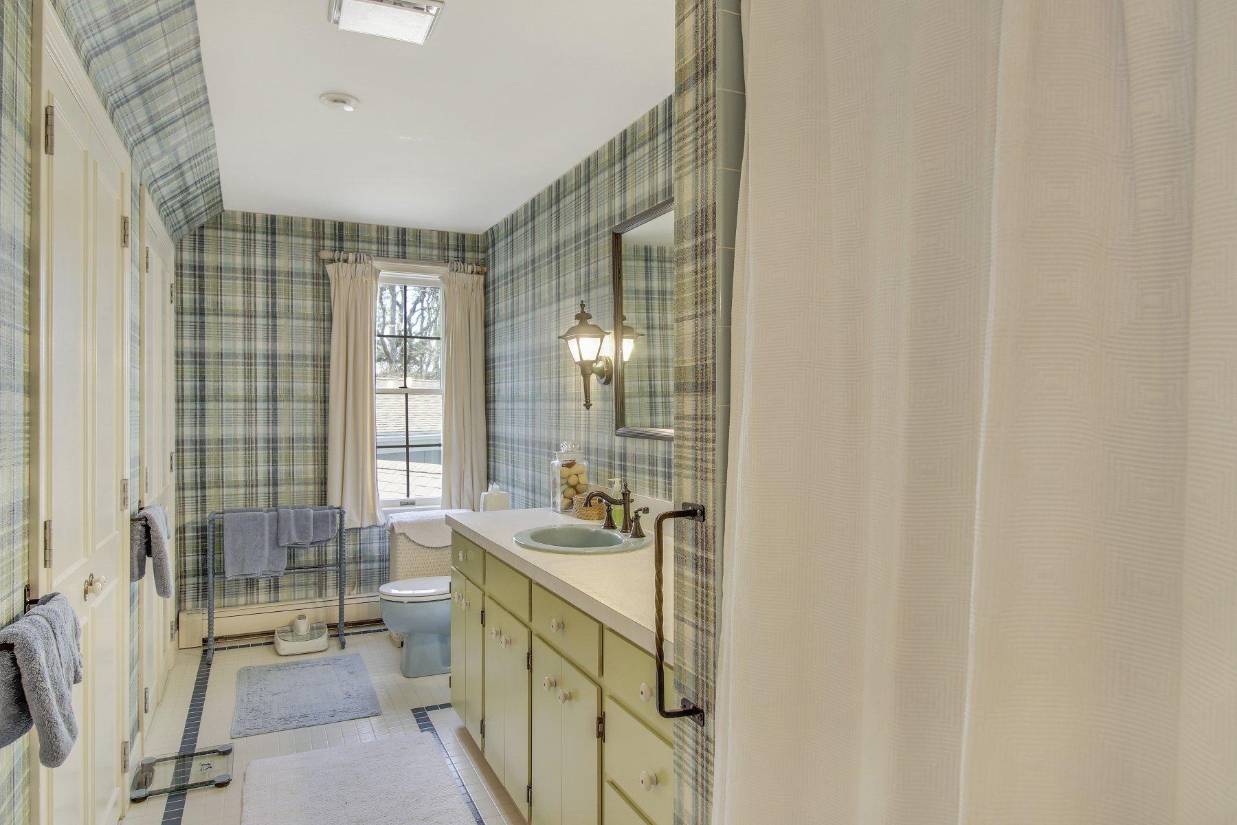 7 Portside Lane Orleans, MA 02653 - Photo 22 of 34 a bathroom with a sink a mirror and a shower