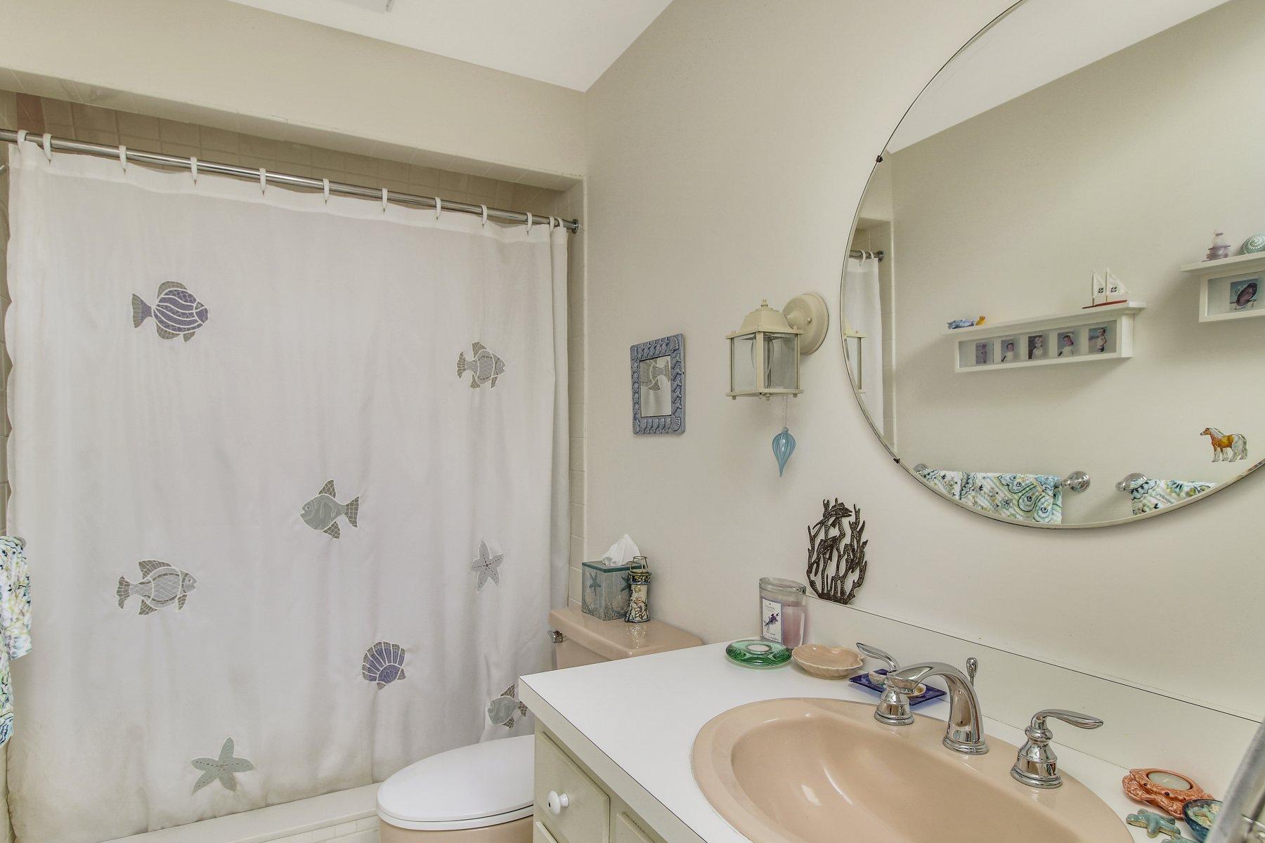 7 Portside Lane Orleans, MA 02653 - Photo 25 of 34 a bathroom with a sink and a mirror