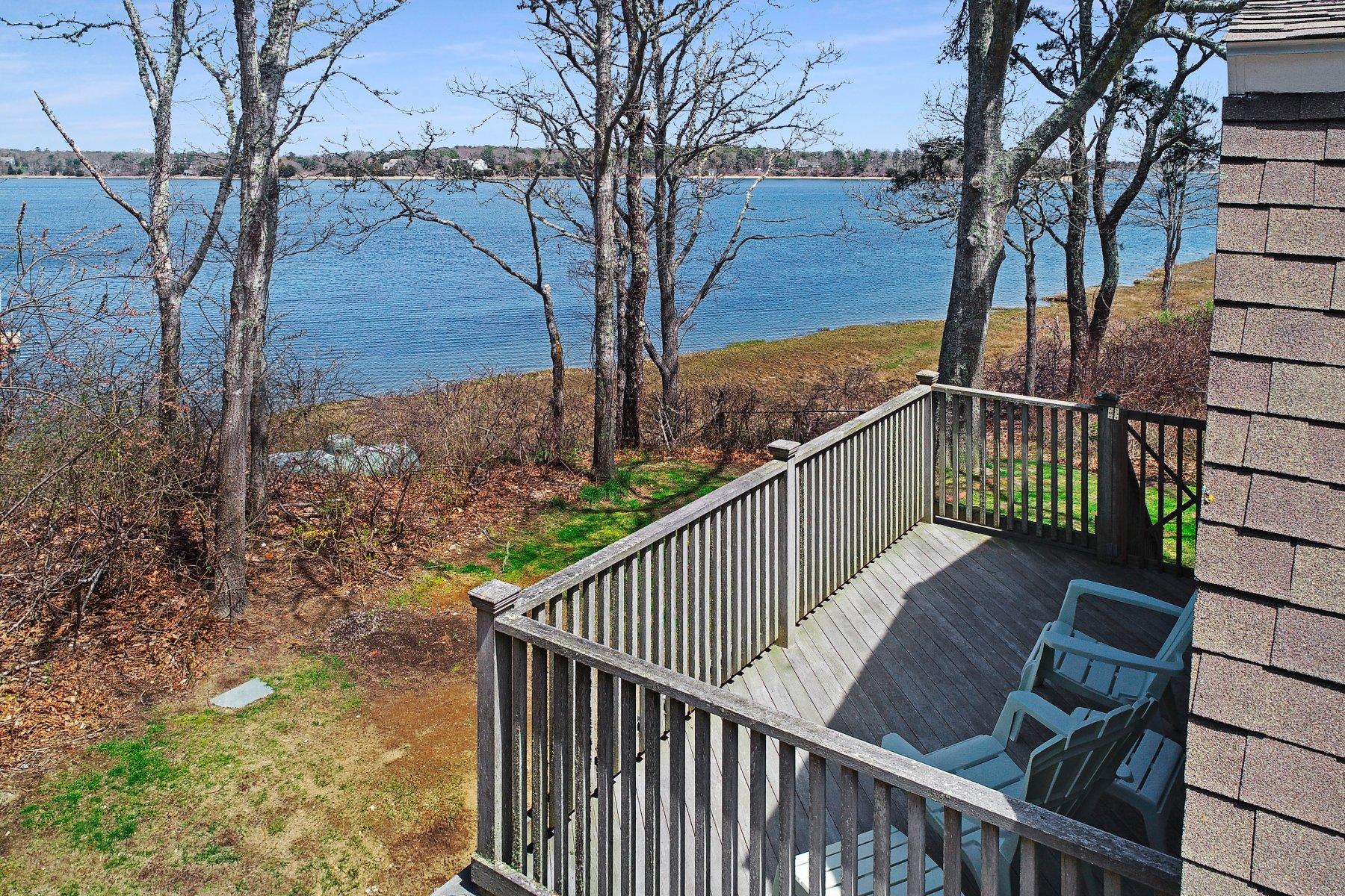 7 Portside Lane Orleans, MA 02653 - Photo 30 of 34 a view of a balcony with wooden floor and fence