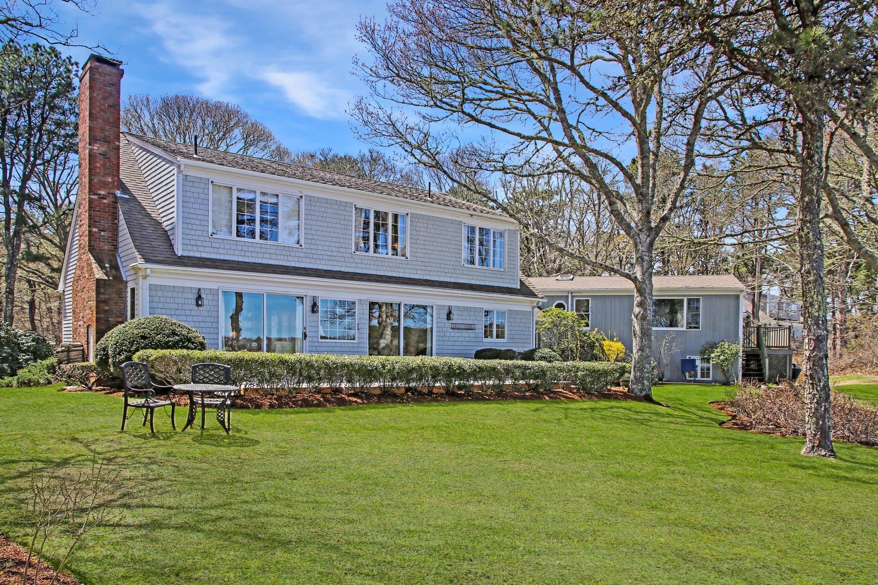7 Portside Lane Orleans, MA 02653 - Photo 4 of 34 a front view of a building with a garden