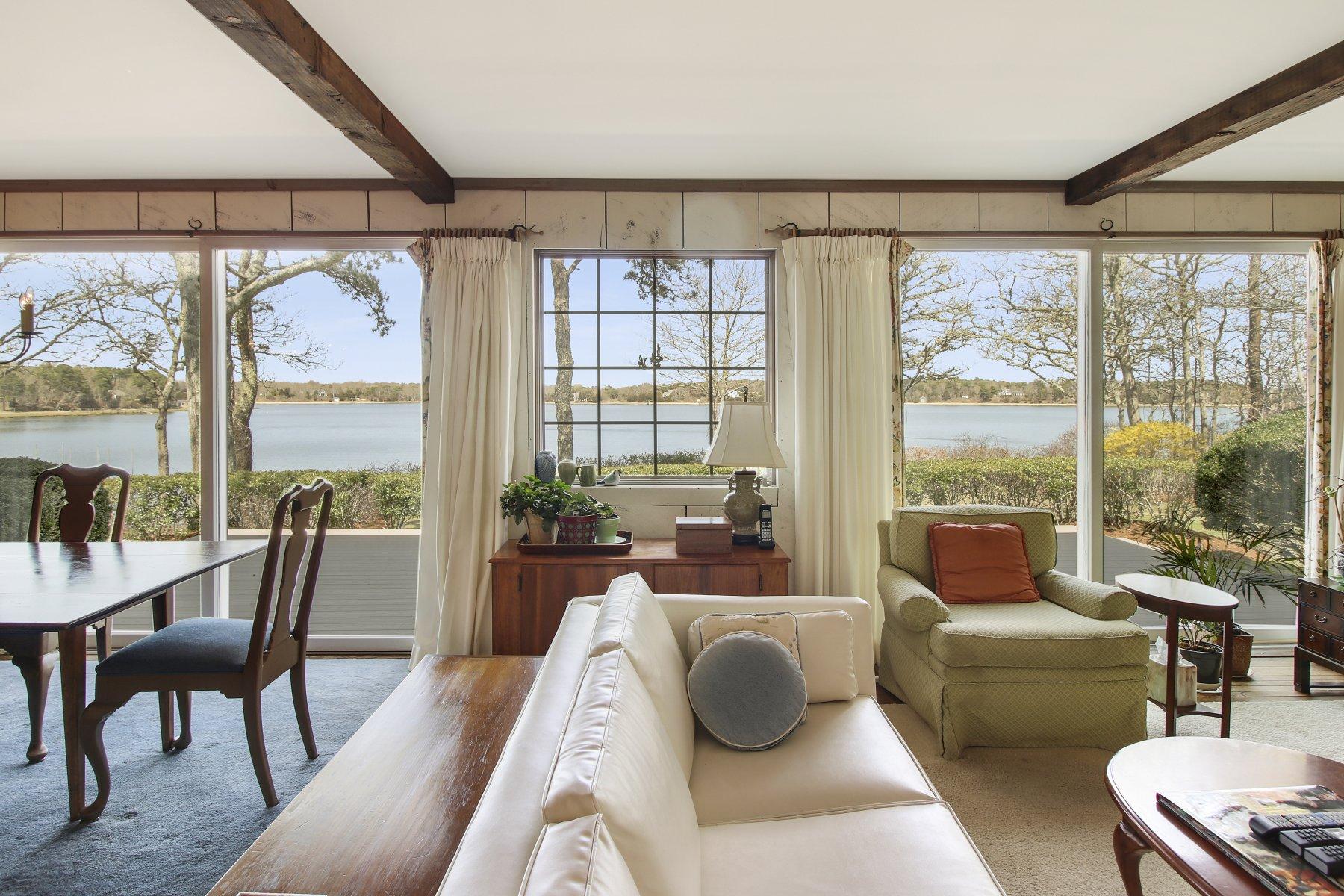 7 Portside Lane Orleans, MA 02653 - Photo 6 of 34 a living room with furniture and a large window