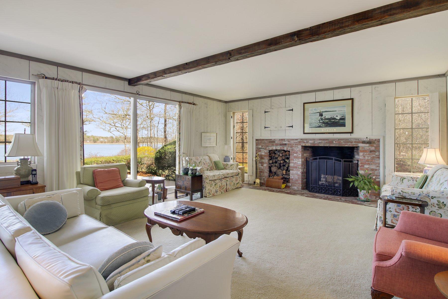 7 Portside Lane Orleans, MA 02653 - Photo 7 of 34 a living room with furniture large window and fireplace