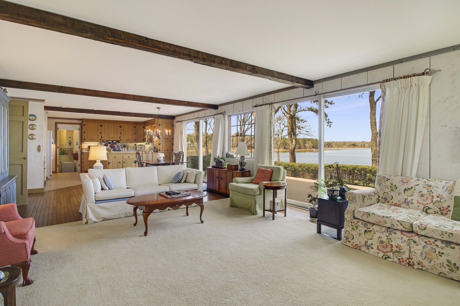 7 Portside Lane Orleans, MA 02653 - Photo 8 of 34 a living room with furniture and large windows