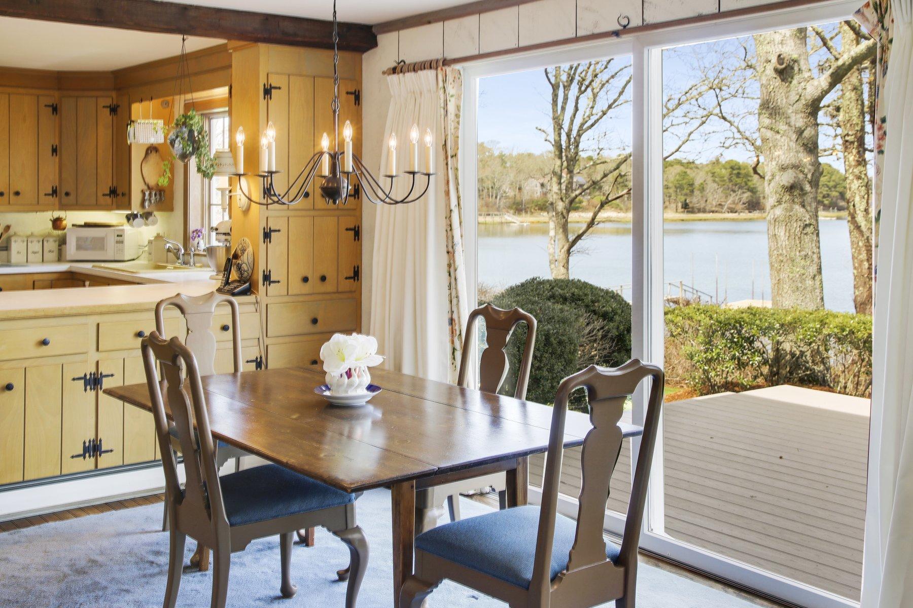 7 Portside Lane Orleans, MA 02653 - Photo 9 of 34 a view of a dining room with furniture window and outside view