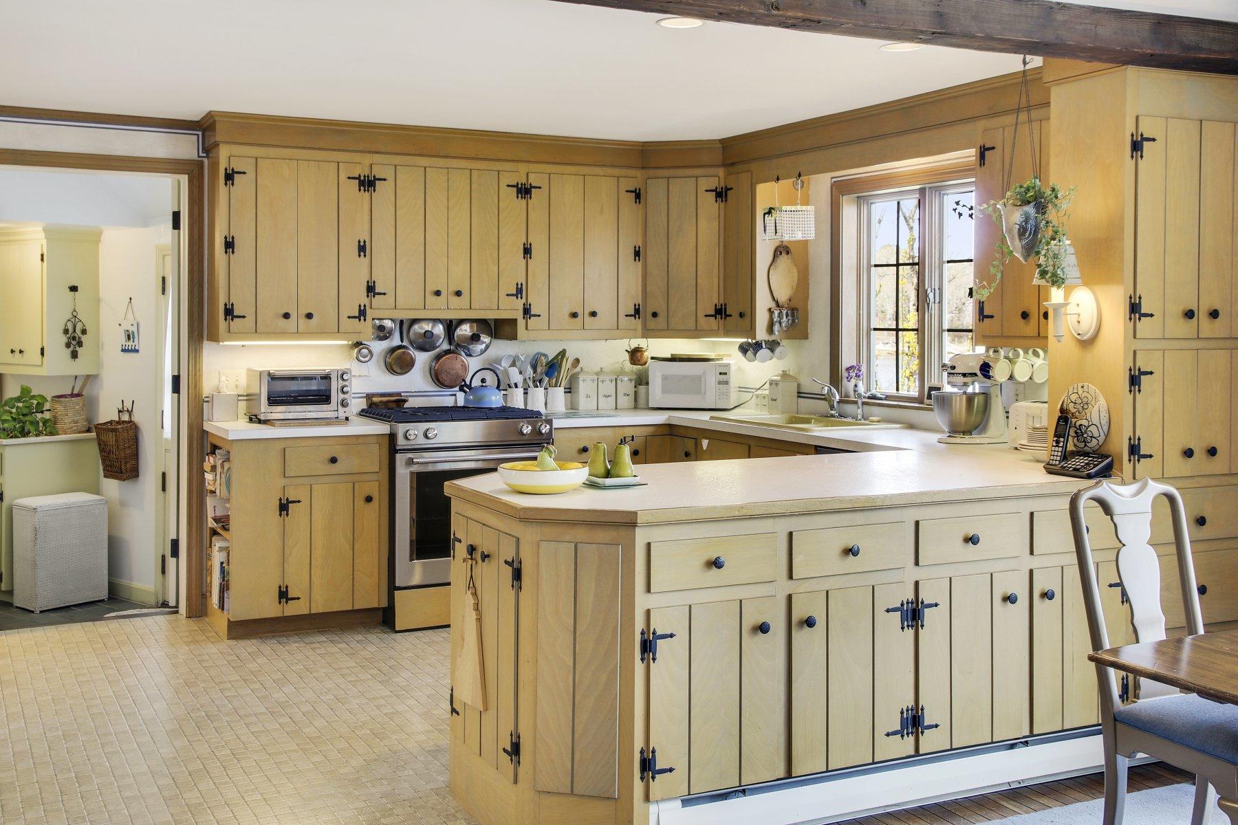 7 Portside Lane Orleans, MA 02653 - Photo 10 of 34 a view of a kitchen with a sink and dishwasher a stove with wooden floor