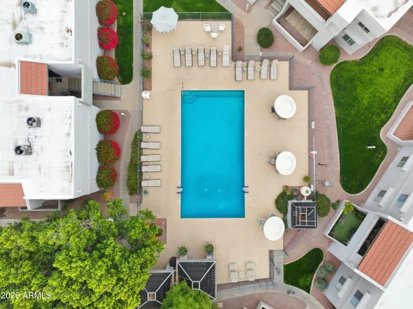 an aerial view of residential houses with outdoor space