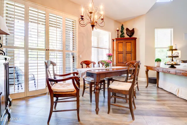 a dining room with furniture and wooden floor