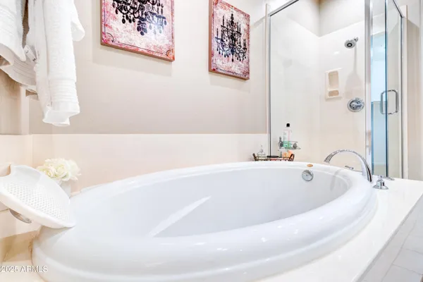 a bath tub sitting next to a white toilet