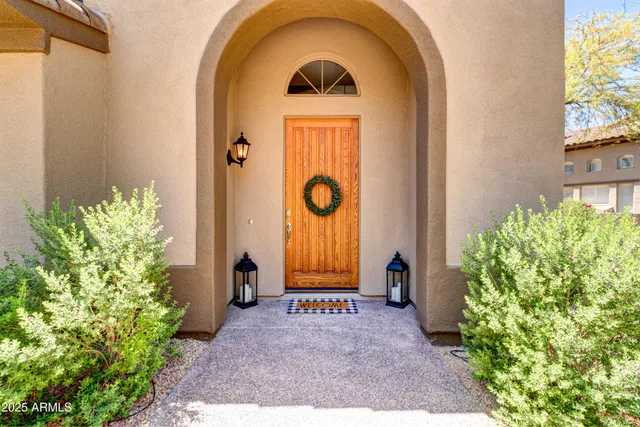 a view of an entryway with wooden floor and a yard