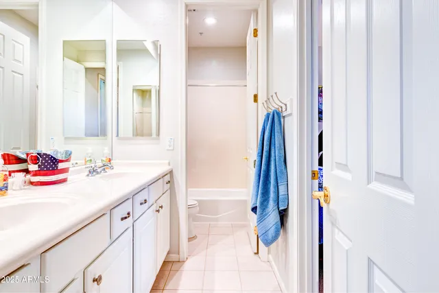 a bathroom with a sink vanity and a mirror