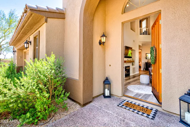 a living room with furniture fireplace and flat screen tv