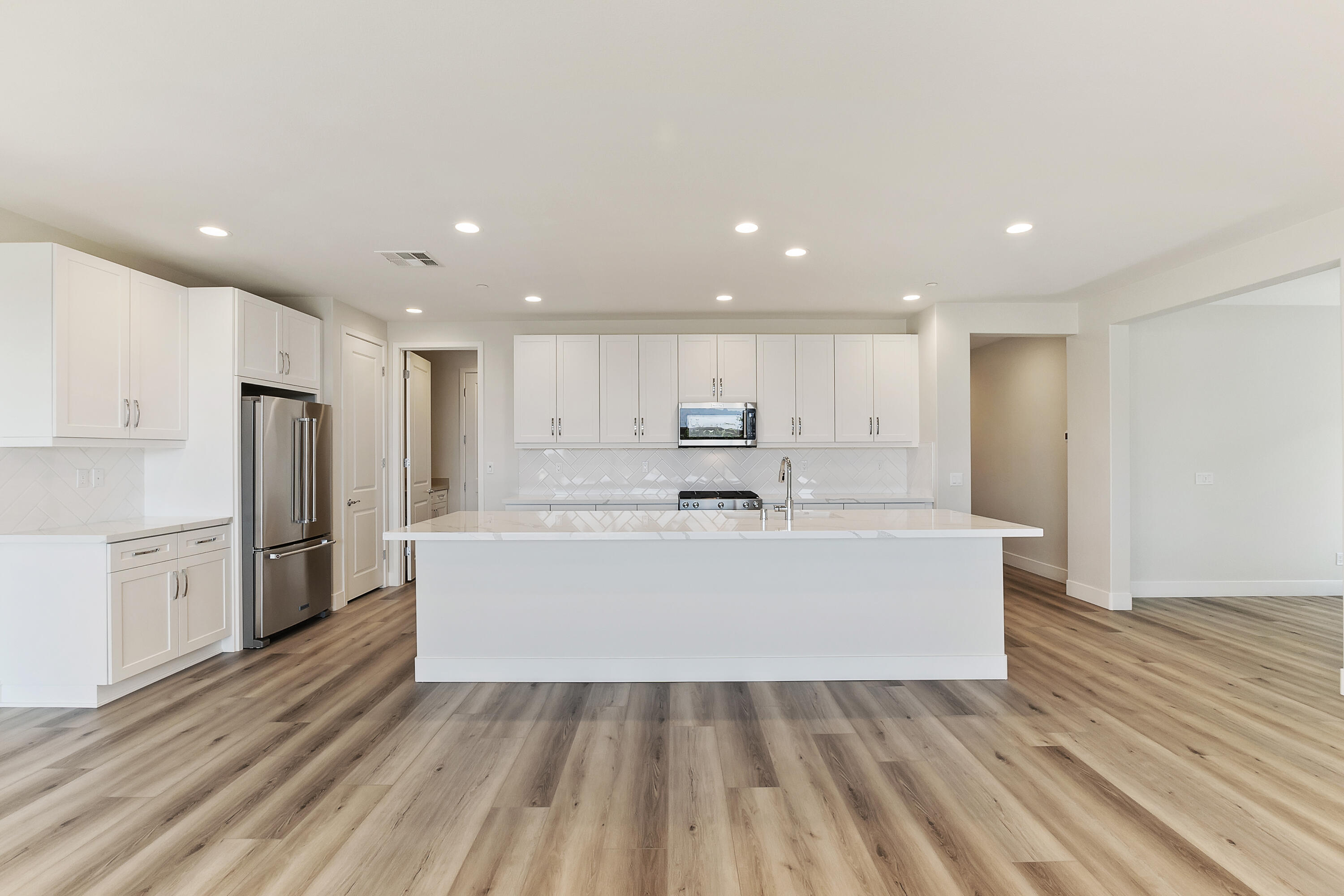 82365 Murray Canyon Drive, Unit LT#8199 Indio, CA 92201 - Photo 13 of 39 a view of kitchen with stainless steel appliances refrigerator stove microwave and cabinets