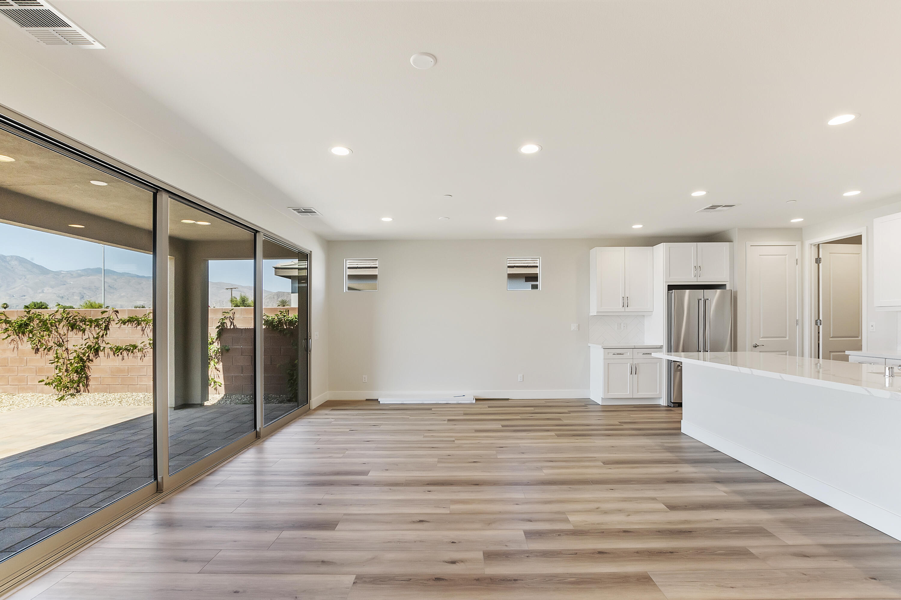 82365 Murray Canyon Drive, Unit LT#8199 Indio, CA 92201 - Photo 15 of 39 a big room with wooden floor and windows