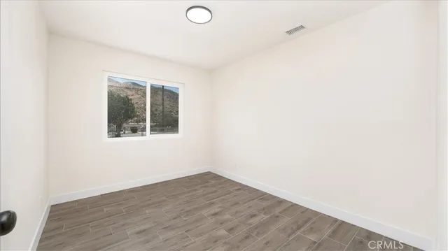a bathroom with a sink toilet and a mirror
