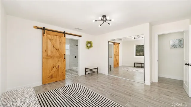 a view of a house with snow on the road