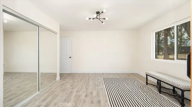 an aerial view of a house with a yard and trees