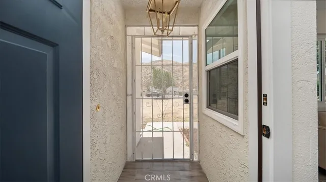 a living room with furniture window and a fireplace