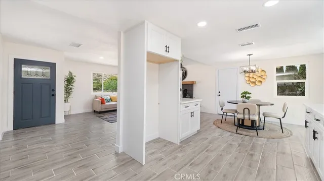 a kitchen with granite countertop stainless steel appliances sink and cabinets
