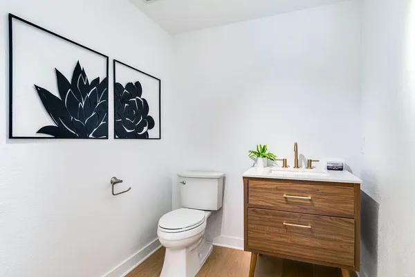 a bathroom with a double vanity sink mirror and shower