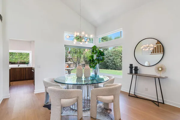 a view of a dining room with furniture window and outside view
