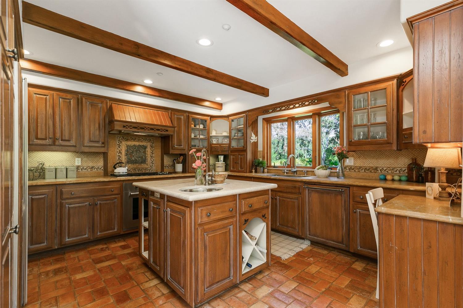 1712 Ladera Road Ojai, CA 93023 - Photo 14 of 47 a kitchen with stainless steel appliances granite countertop a sink stove and cabinets