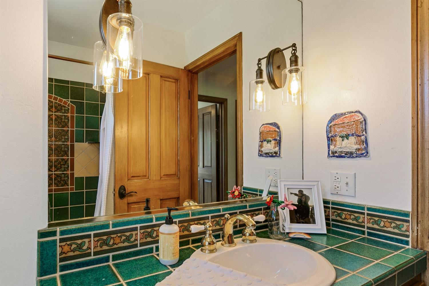 1712 Ladera Road Ojai, CA 93023 - Photo 22 of 47 a bathroom with a mirror a sink and a shower