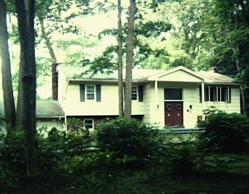 74 Hills Point Road Trumbull, CT 06611 - Photo 1 of 1 a front view of a house with a yard