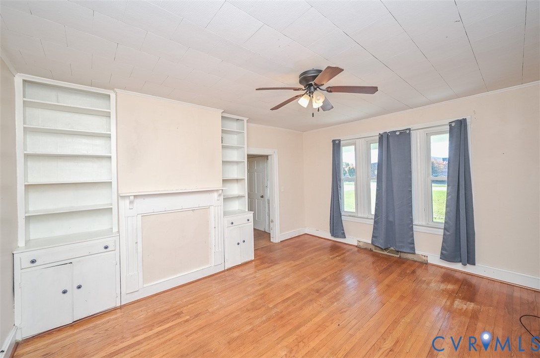 17519 New Baltimore Road Milford, VA 22514 - Photo 11 of 38 a view of a room with cabinet and a ceiling fan