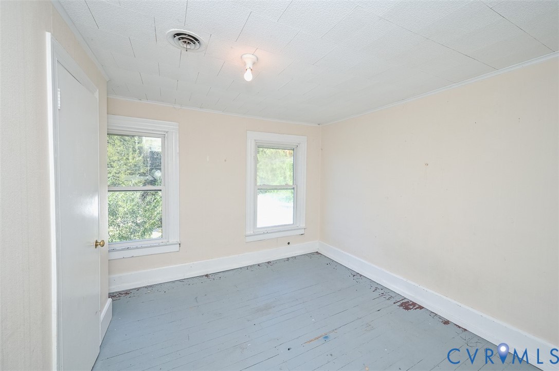 17519 New Baltimore Road Milford, VA 22514 - Photo 28 of 38 an empty room with wooden floor and windows