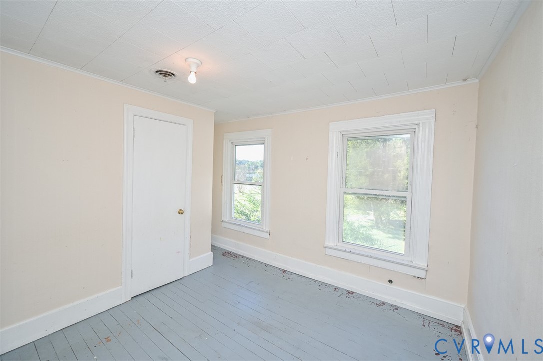 17519 New Baltimore Road Milford, VA 22514 - Photo 29 of 38 an empty room with wooden floor and windows